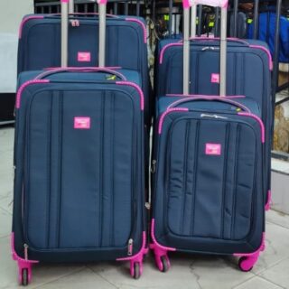 4-piece navy blue and pink softside luggage set with spinner wheels