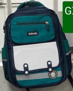 Green and navy blue school backpack with white front pocket and multiple compartments