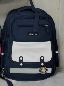 Navy blue school backpack with white front pocket and multiple compartments