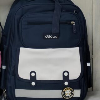 Navy blue school backpack with white front pocket and multiple compartments