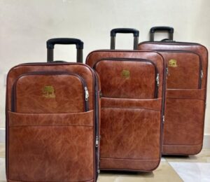 Brown leather textured trolley suitcase set with wheels and retractable handles – 3 piece luggage set for travel.