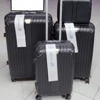 Set of 4 black hard shell suitcases with spinner wheels, including carry-on and travel bag.