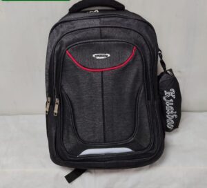 A black and gray-toned backpack with a sleek, modern design. and a small, detachable accessory pouch hangs from the side.