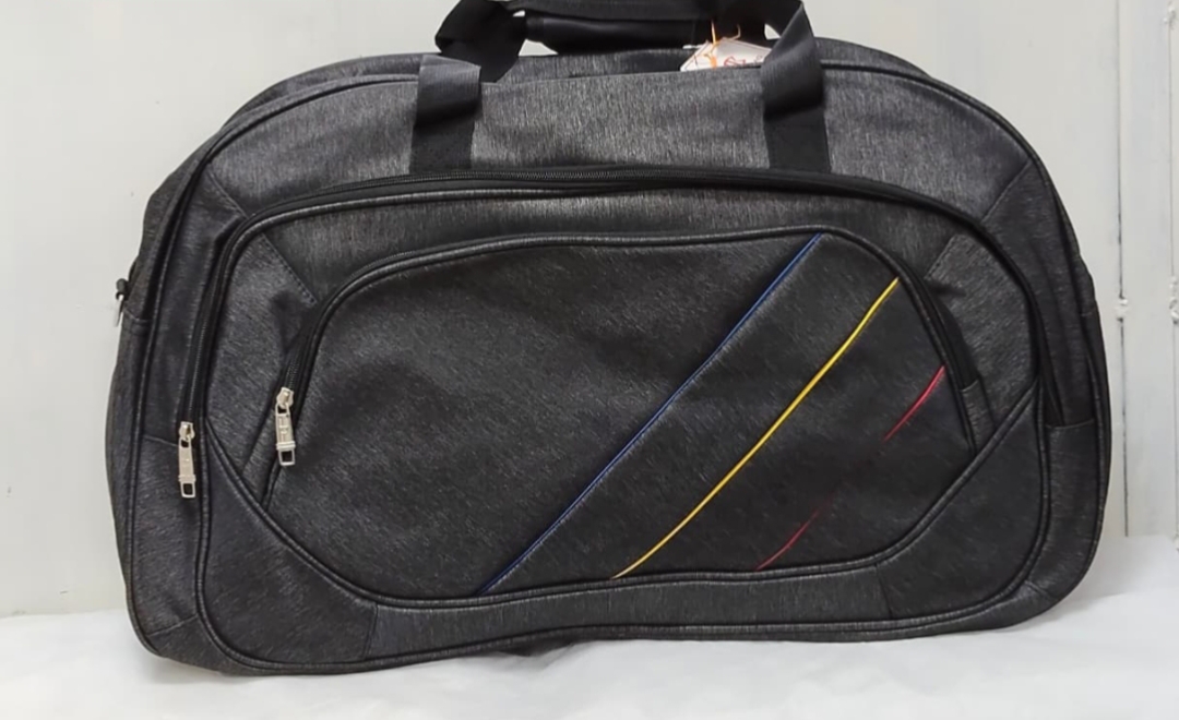 Black travel duffel bag with multicolor stripe design and front zipper pockets"