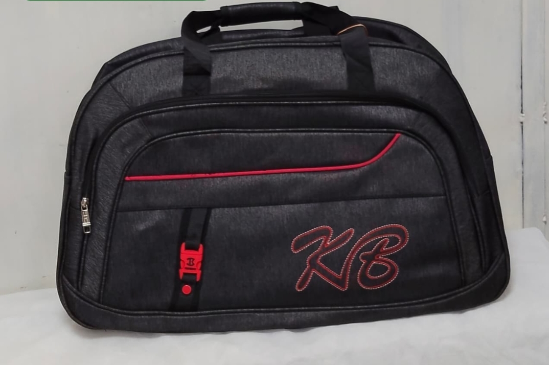 Black travel duffel bag with red accents and KB embroidery