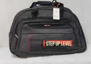 Black duffel travel bag with “STEP UP LEVEL” design in red and white print