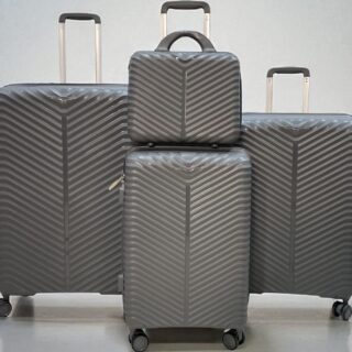 4-piece grey hard shell luggage set with chevron pattern, includes large suitcases, carry-on, and travel bag