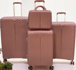 4 pieces of rose gold hard-shell rolling suitcases in varying size