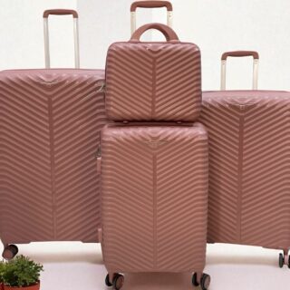 4 pieces of rose gold hard-shell rolling suitcases in varying size