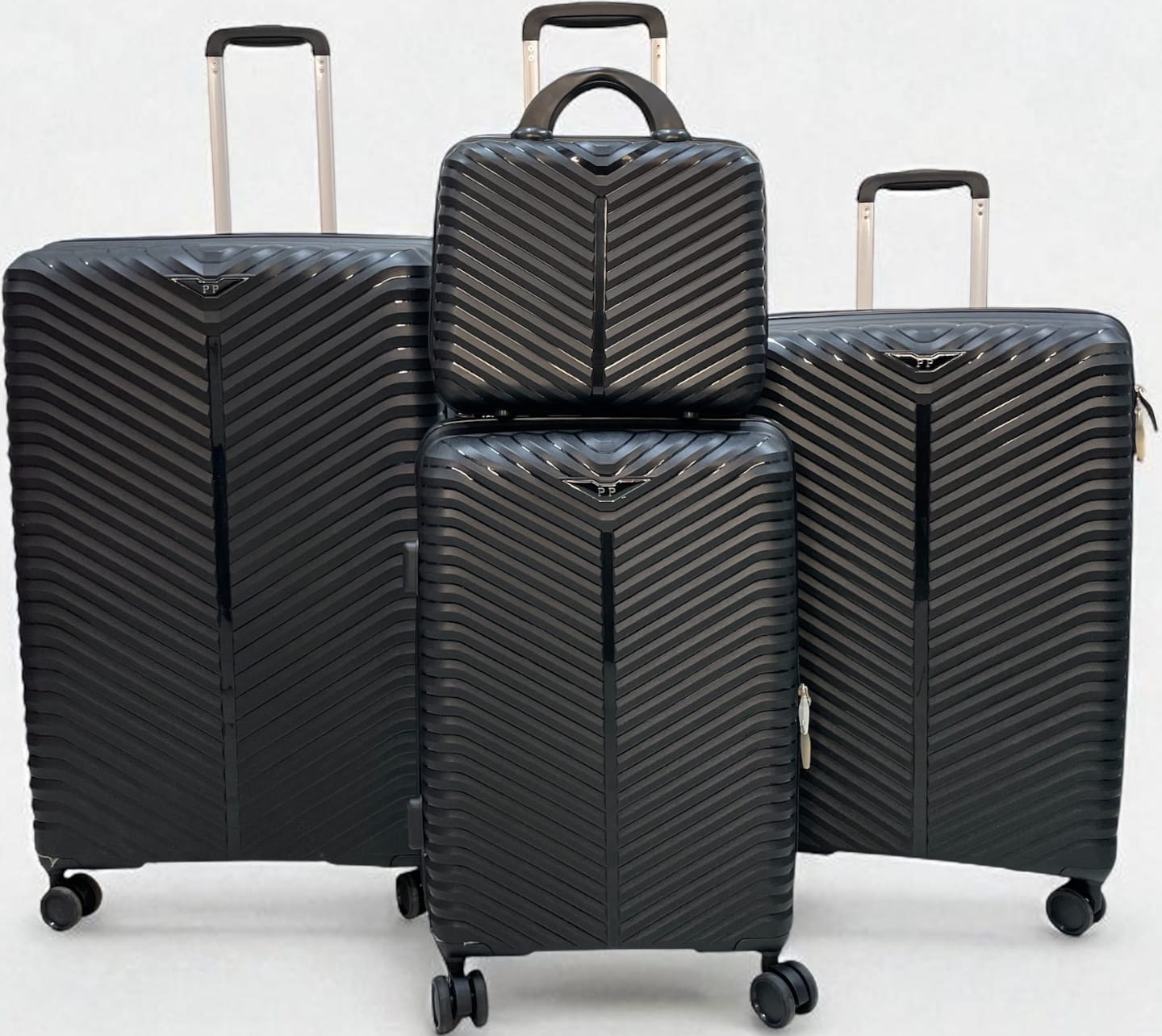 4-piece black hard shell luggage set with chevron pattern, includes large suitcases, carry-on, and travel bag