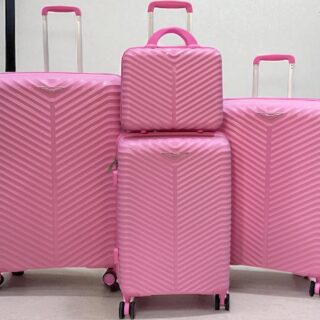 A set of 4 Bubblegum Pink hard-shell rolling suitcases