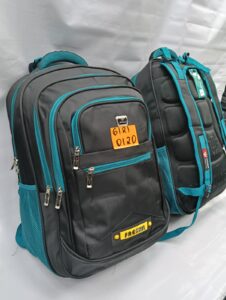 Black and teal backpacks with multiple zippered compartments and padded backs