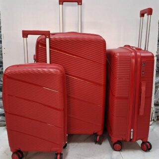 A set of three red hard-shell rolling suitcases in large, medium, and small sizes.