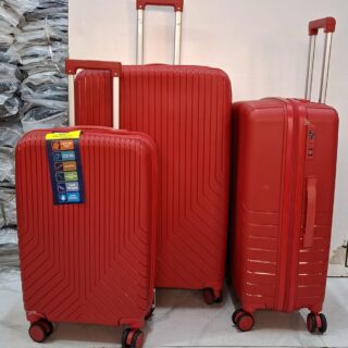 A set of three red hard-shell rolling suitcases in large, medium, and small sizes.