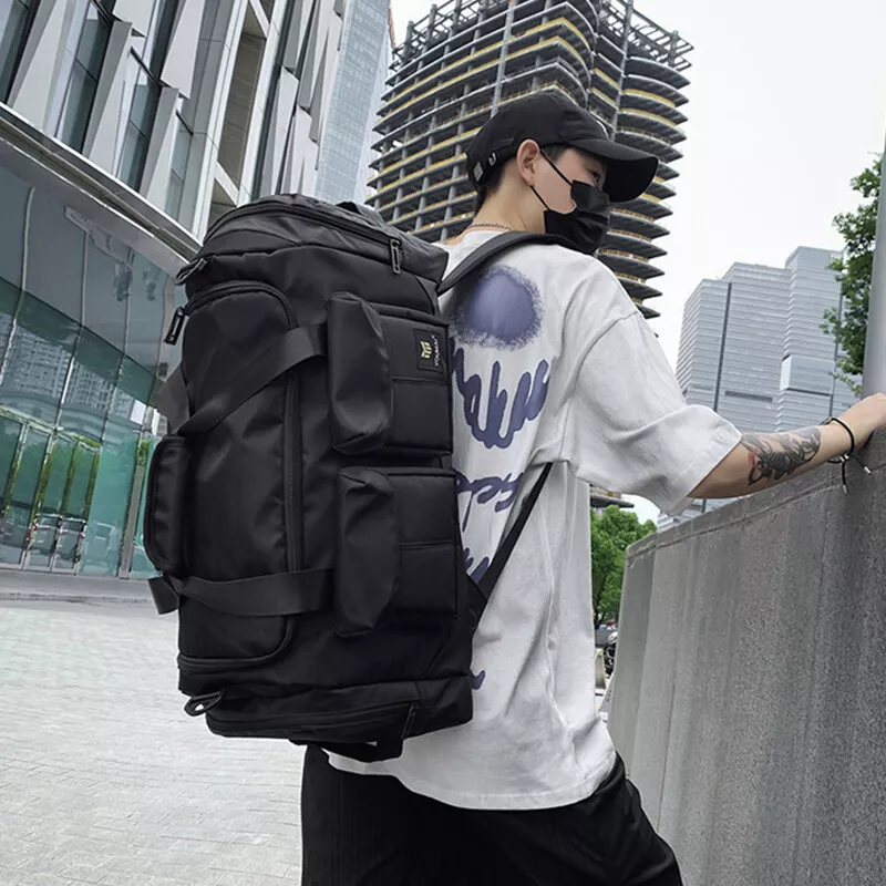 Large black multi-pocket backpack duffel with adjustable straps, side handles, and spacious compartments – ideal for travel, sports, or outdoor use